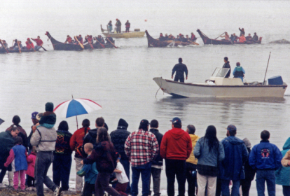 Makah canoes towing 99 whale to shore