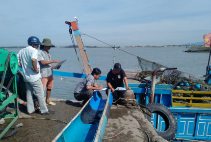 Lindsay interviewing fishermen in Vietnam