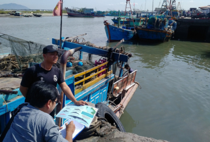 Lindsay interviewing fishermen in Vietnam 2